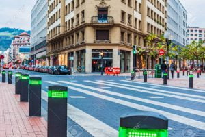 Modern traffic lights posts on pedestrian crossing